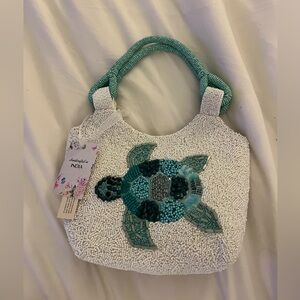Viral green and white beaded turtle bag